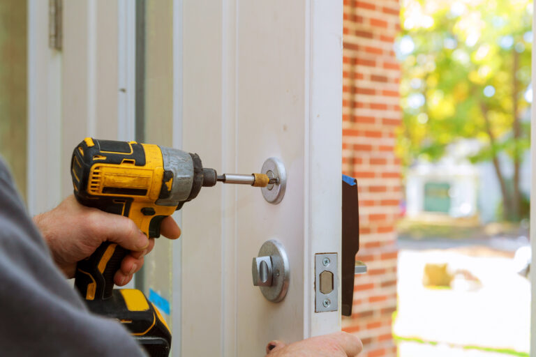 man repairing the a door lock